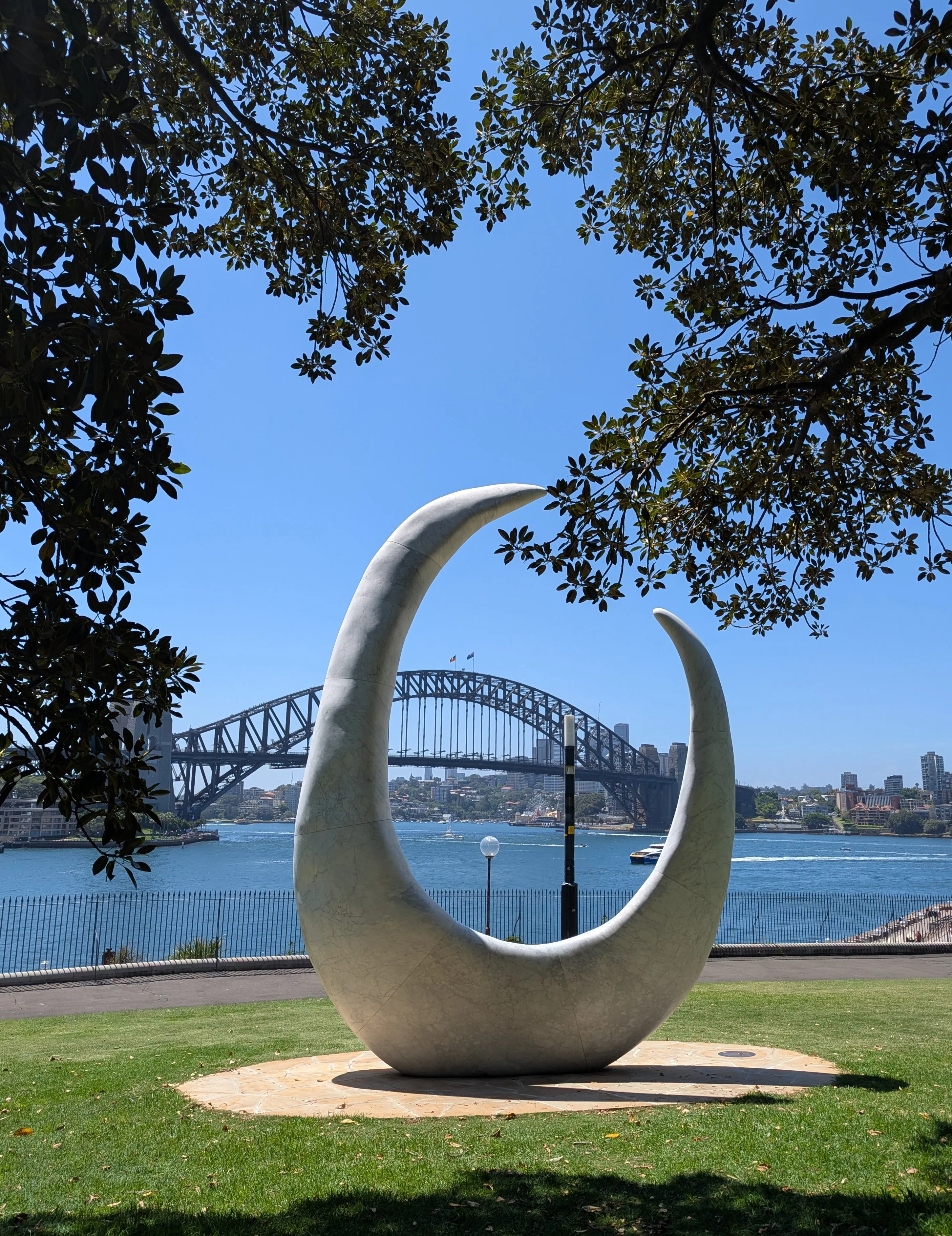 The Harbour Bridge framed by a sculpture.